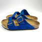 Side view of  Blue Birkenstock with 2 straps & Copper buckles
