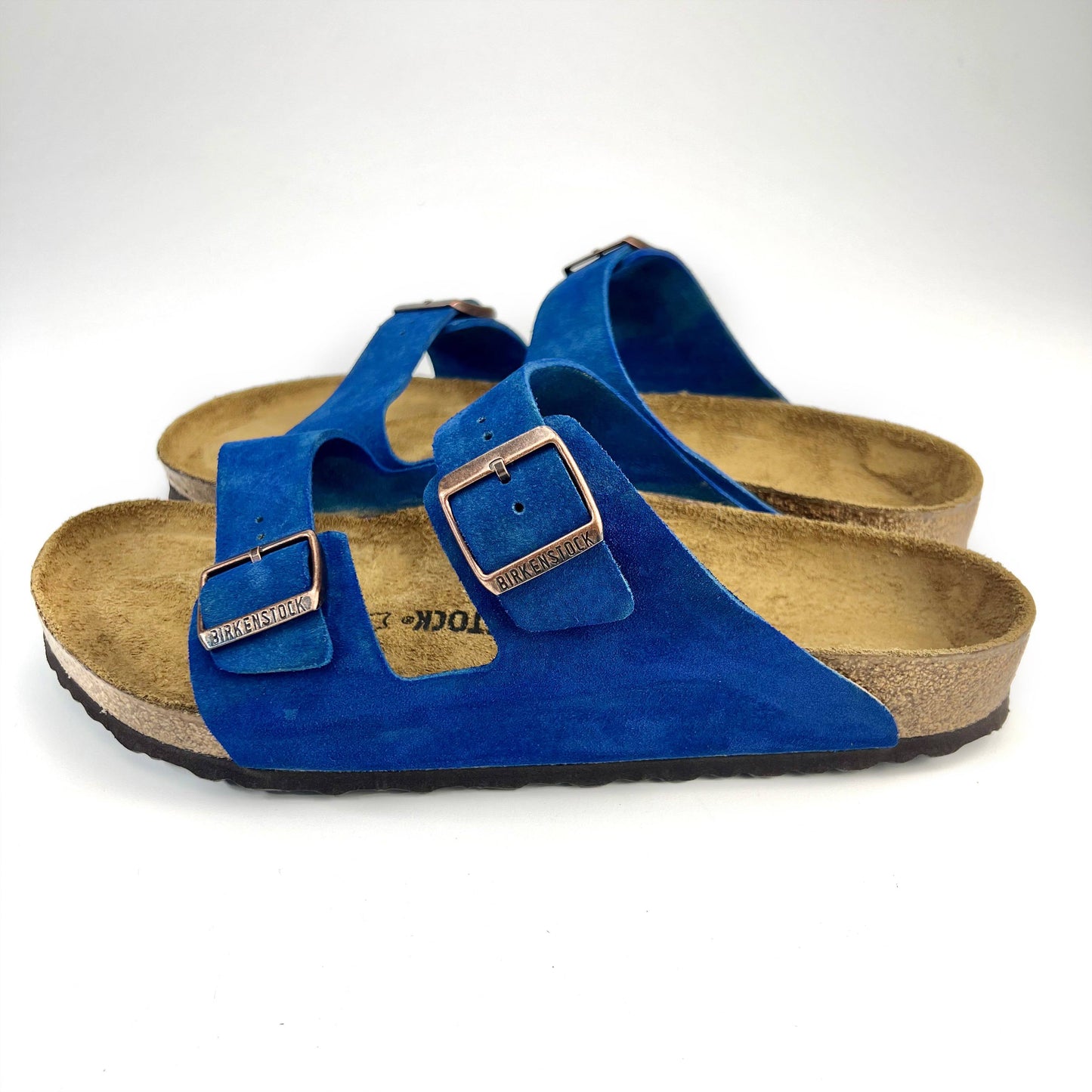 Side view of  Blue Birkenstock with 2 straps & Copper buckles