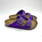 Purple Birkenstock Sandals with copper buckles & white background
