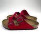 Side view of Red Birkenstock Sandals with 2 copper buckles & white background