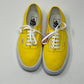 Yello Vans Laced shoes on a white background floor