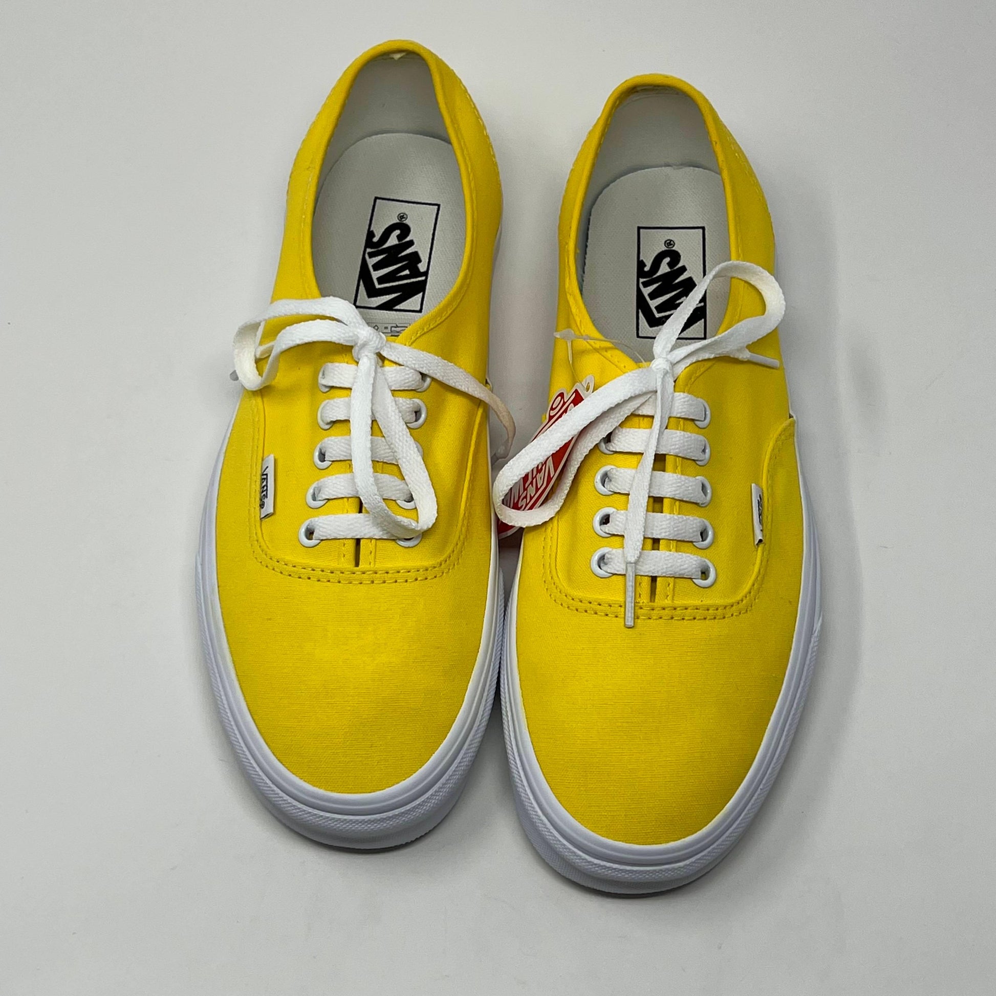 Yello Vans Laced shoes on a white background floor