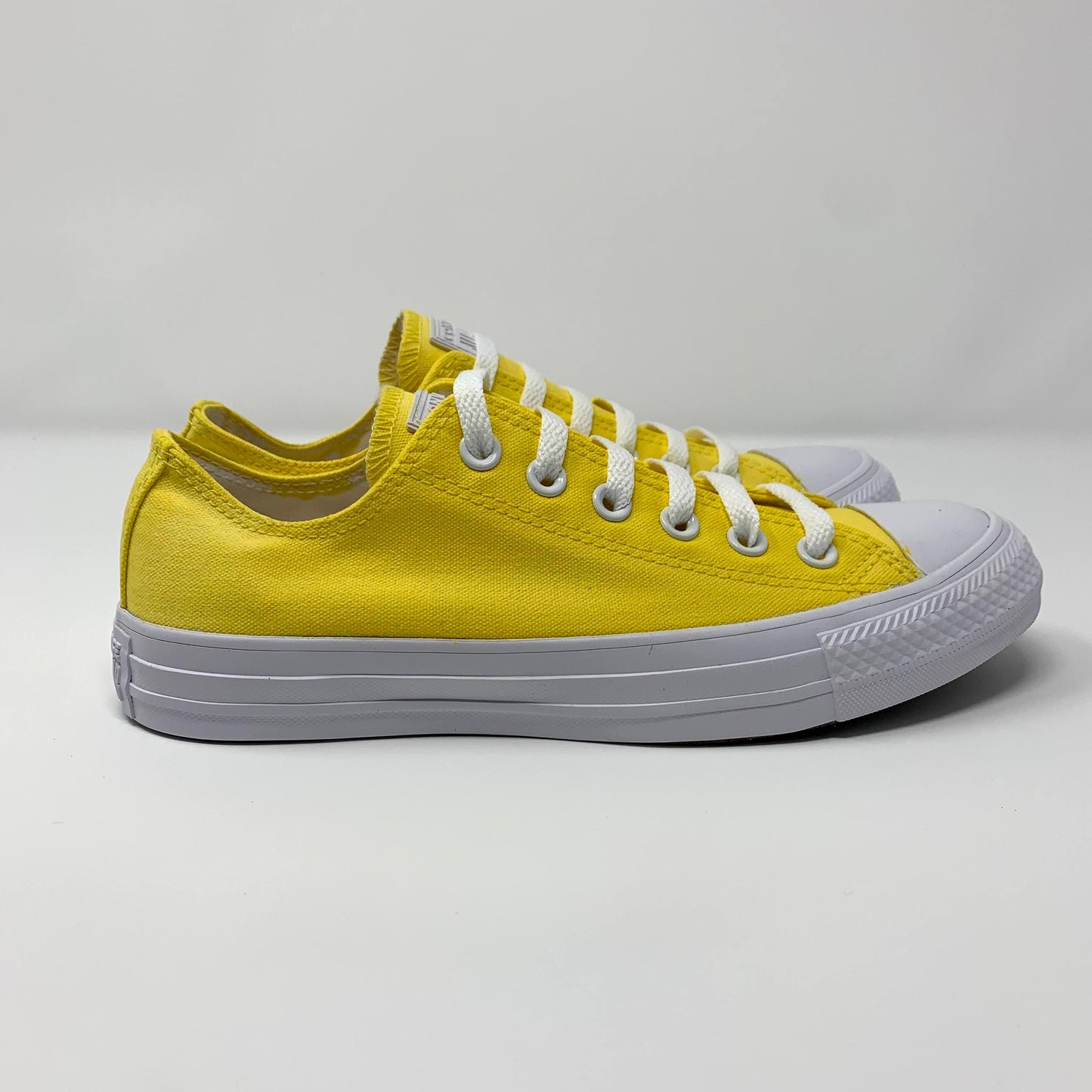 Banana Yellow Low Converse Shoes with white background