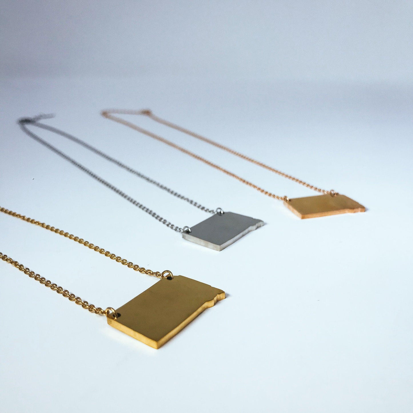 South Dakota State Silhouette Necklaces in 3 different colors: Gold, Silver & Rose Gold